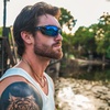 image:imageDUCO Polarized Sports Sunglasses for Men Women UV400 Protection Sun Glasses for Cycling Fishing Running and Driving F101Black Blue Frame Revo Blue Lens